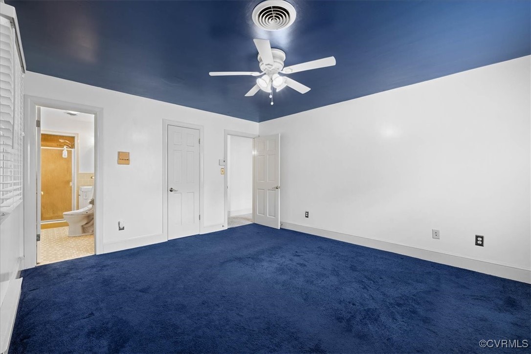 448 Jasper Lane Waverly, VA 23890 - Photo 28 of 44 an empty room with windows and fan