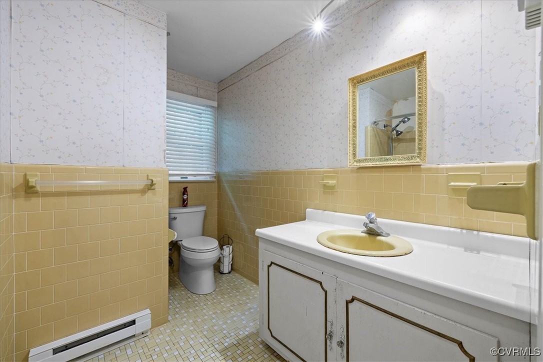 448 Jasper Lane Waverly, VA 23890 - Photo 30 of 44 a bathroom with a sink a toilet and mirror