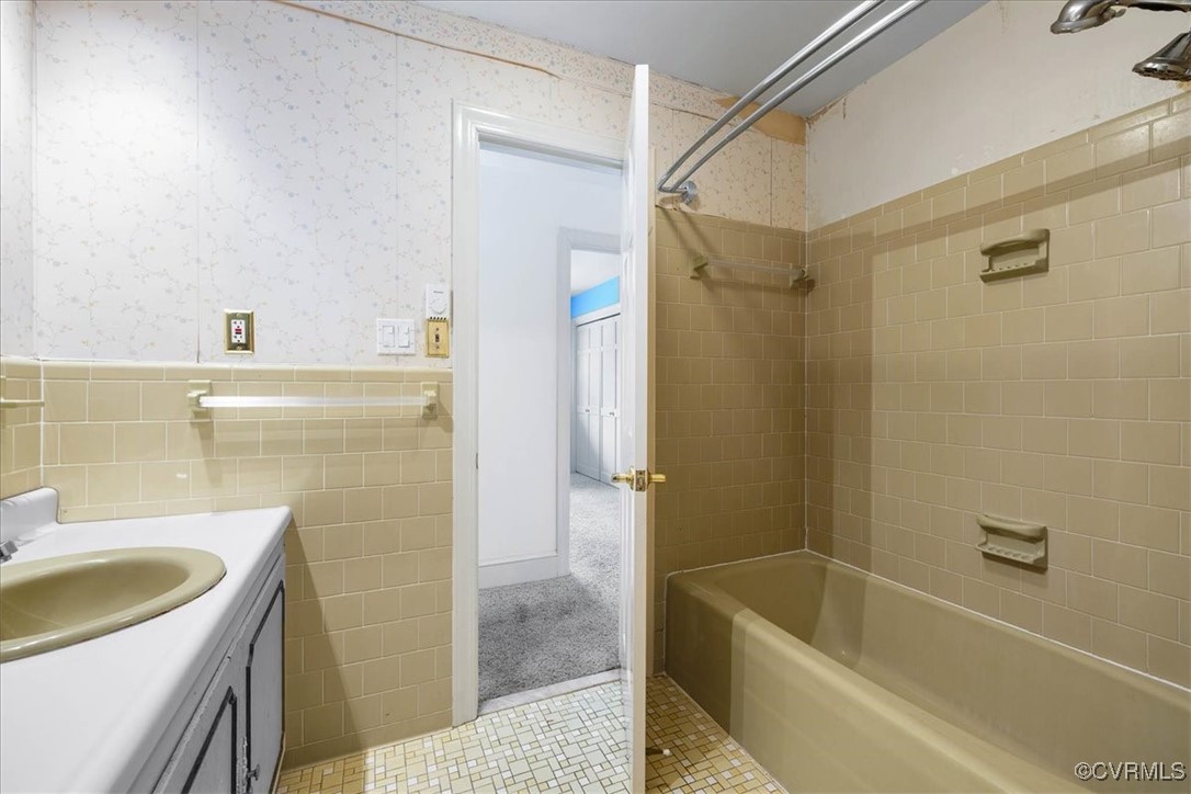 448 Jasper Lane Waverly, VA 23890 - Photo 31 of 44 a bathroom with a tub a sink a mirror and a shower