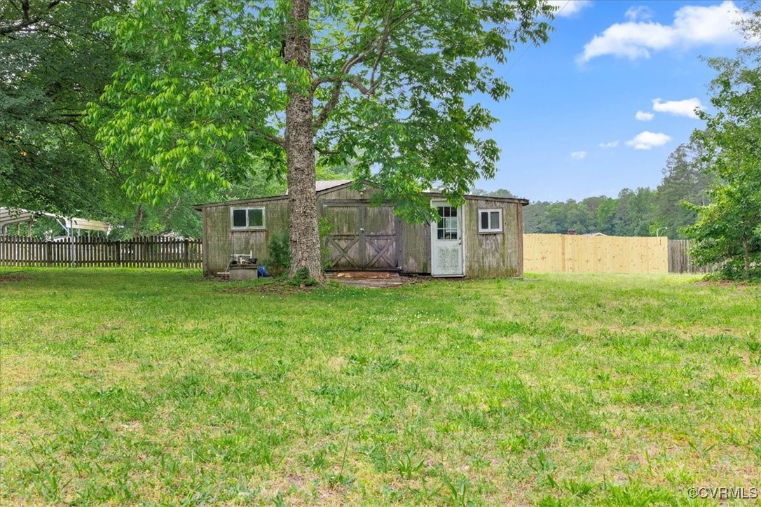 448 Jasper Lane Waverly, VA 23890 - Photo 33 of 44 a front view of house with yard and trees