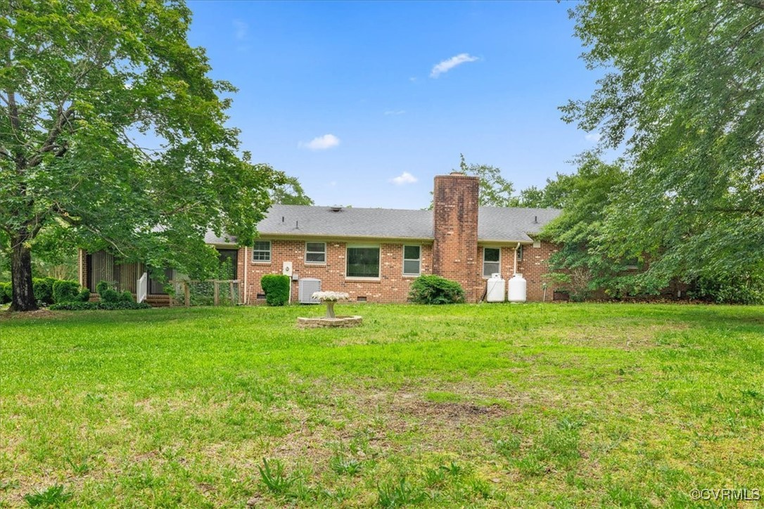 448 Jasper Lane Waverly, VA 23890 - Photo 34 of 44 a front view of a house with garden
