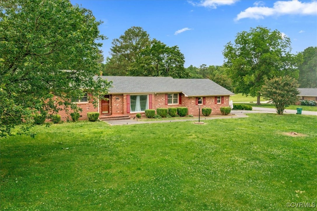448 Jasper Lane Waverly, VA 23890 - Photo 39 of 44 a front view of a house with a yard