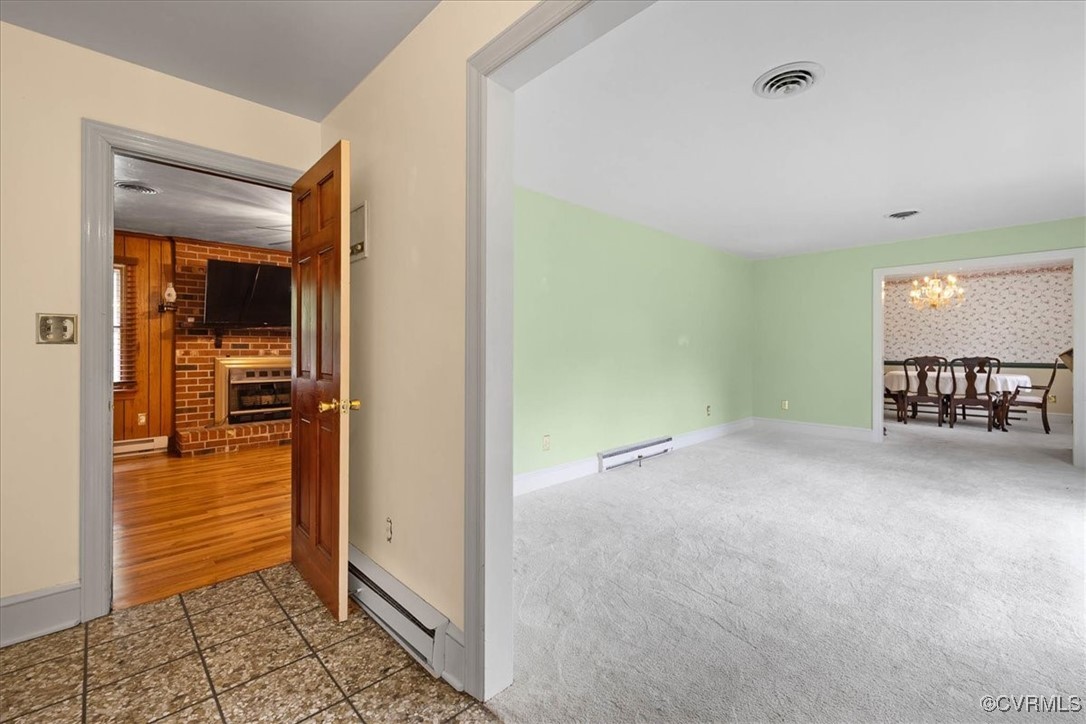448 Jasper Lane Waverly, VA 23890 - Photo 6 of 44 a view of a hallway with wooden floor and a living room