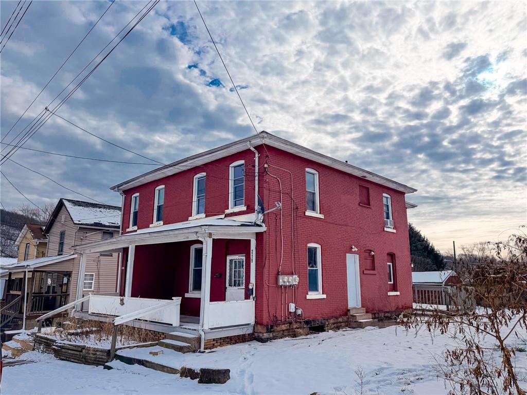 219 13th Street, Unit 2 Beaver Falls, PA 15010 - Photo 2 of 12 a view of a house with a yard