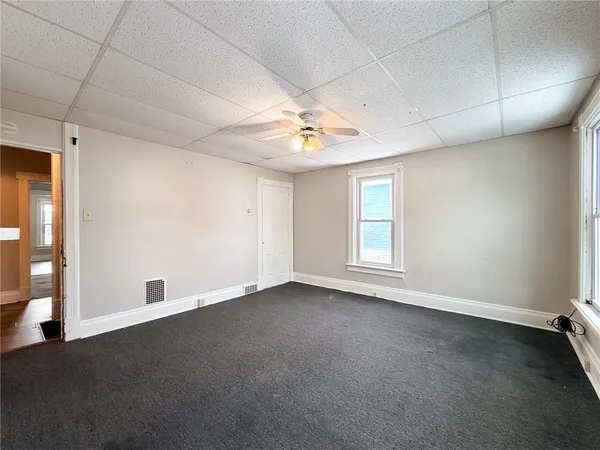 a view of an empty room with a window