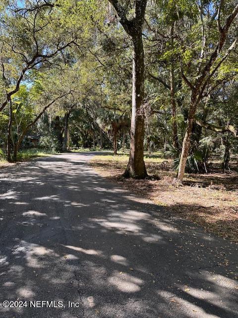 08 Southeast 265th Court Road Umatilla, FL 32784 - Photo 31 of 53 a view of a tree in the middle of a yard