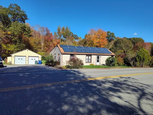 a view of swimming pool and trees in the background