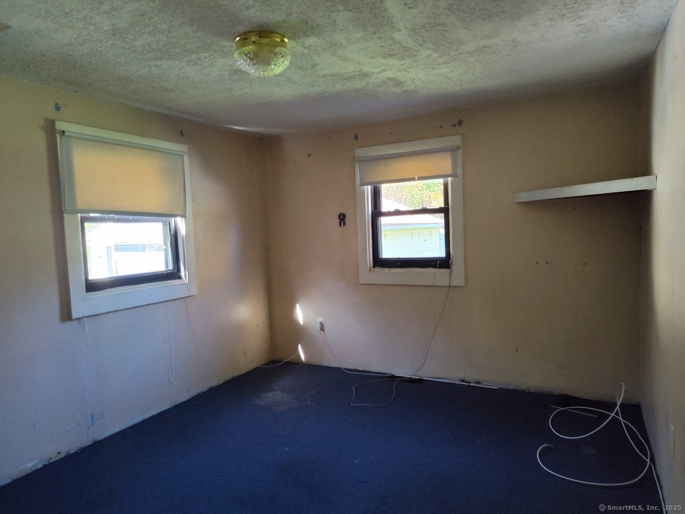 155 Iron Street Ledyard, CT 06339 - Photo 12 of 17 a view of an empty room with a window