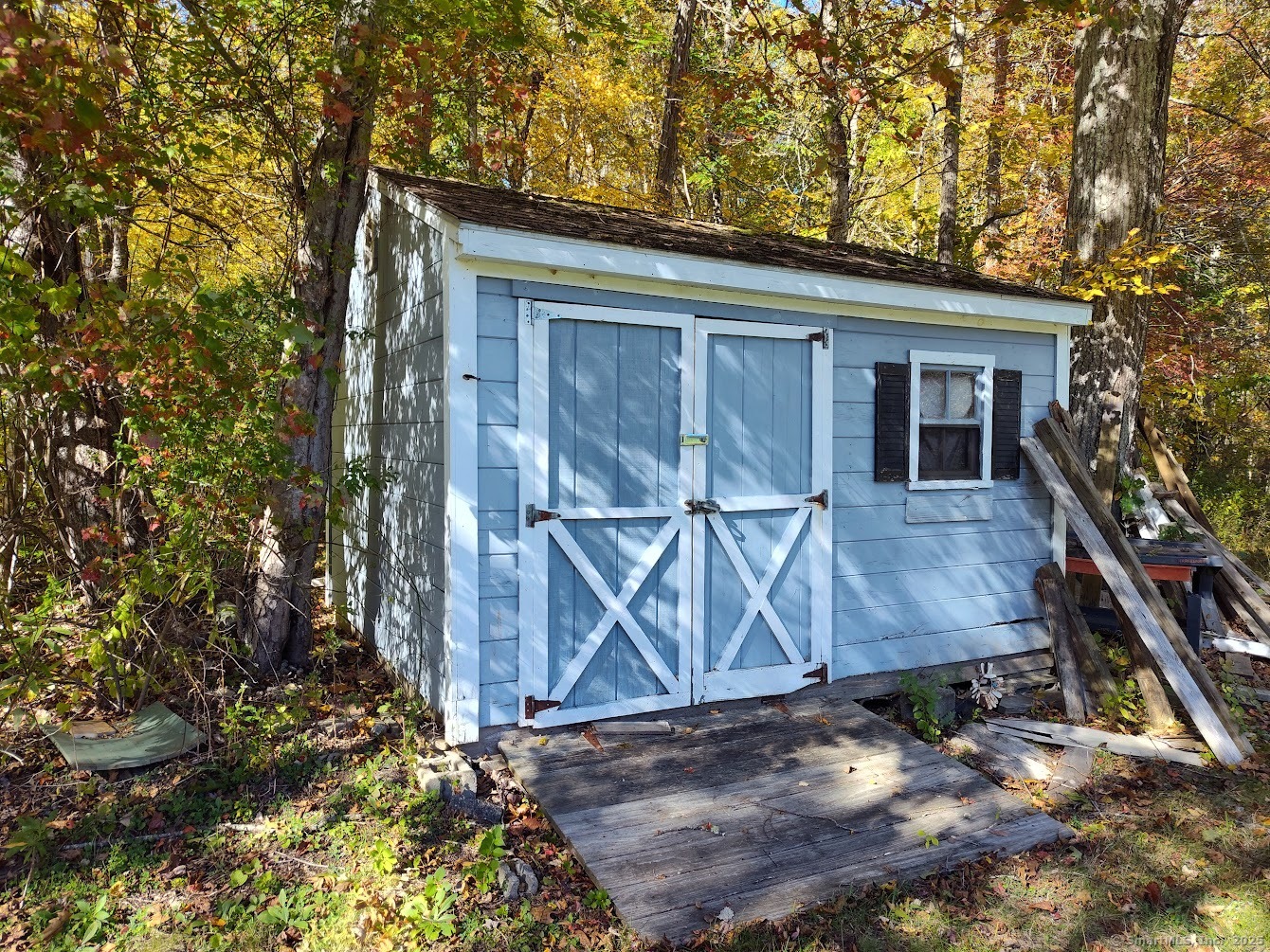 155 Iron Street Ledyard, CT 06339 - Photo 3 of 17 a view of wooden house with a large tree