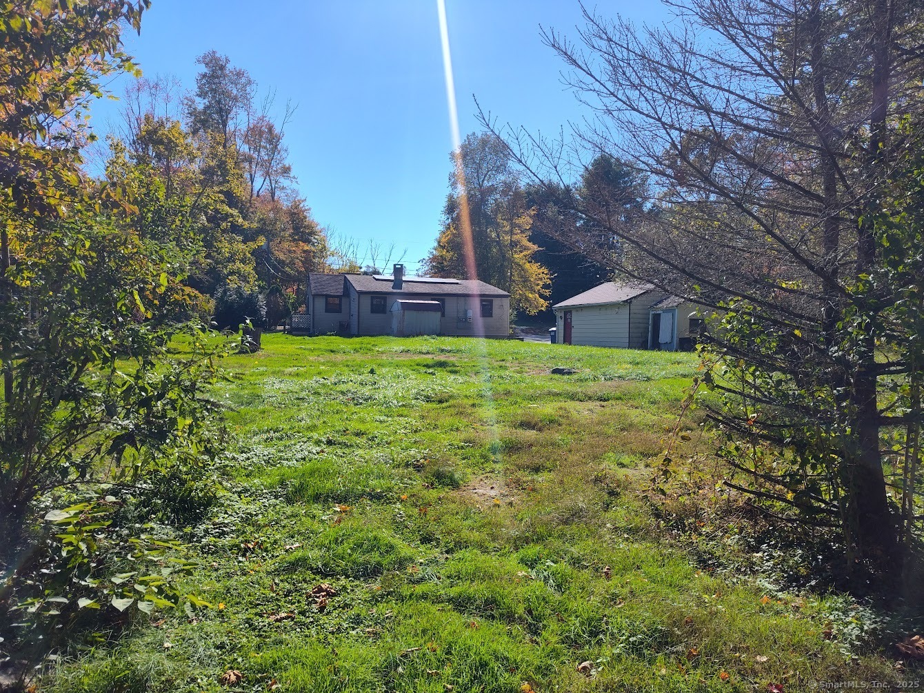 155 Iron Street Ledyard, CT 06339 - Photo 4 of 17 a backyard of a house with lots of green space