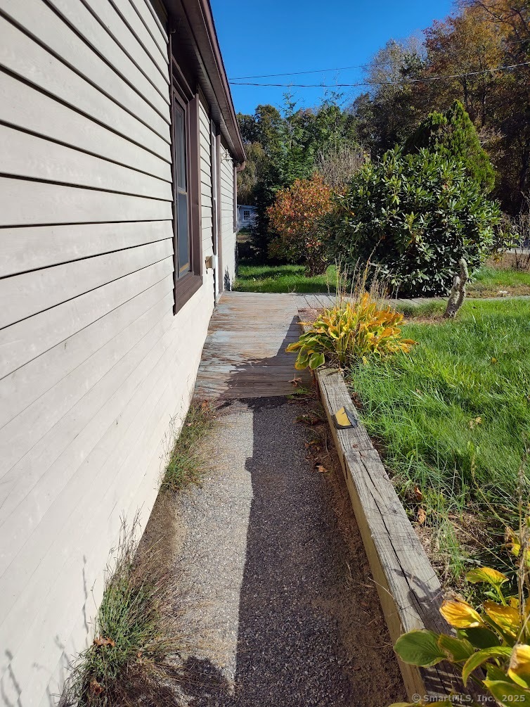 155 Iron Street Ledyard, CT 06339 - Photo 7 of 17 a view of a backyard with pathway