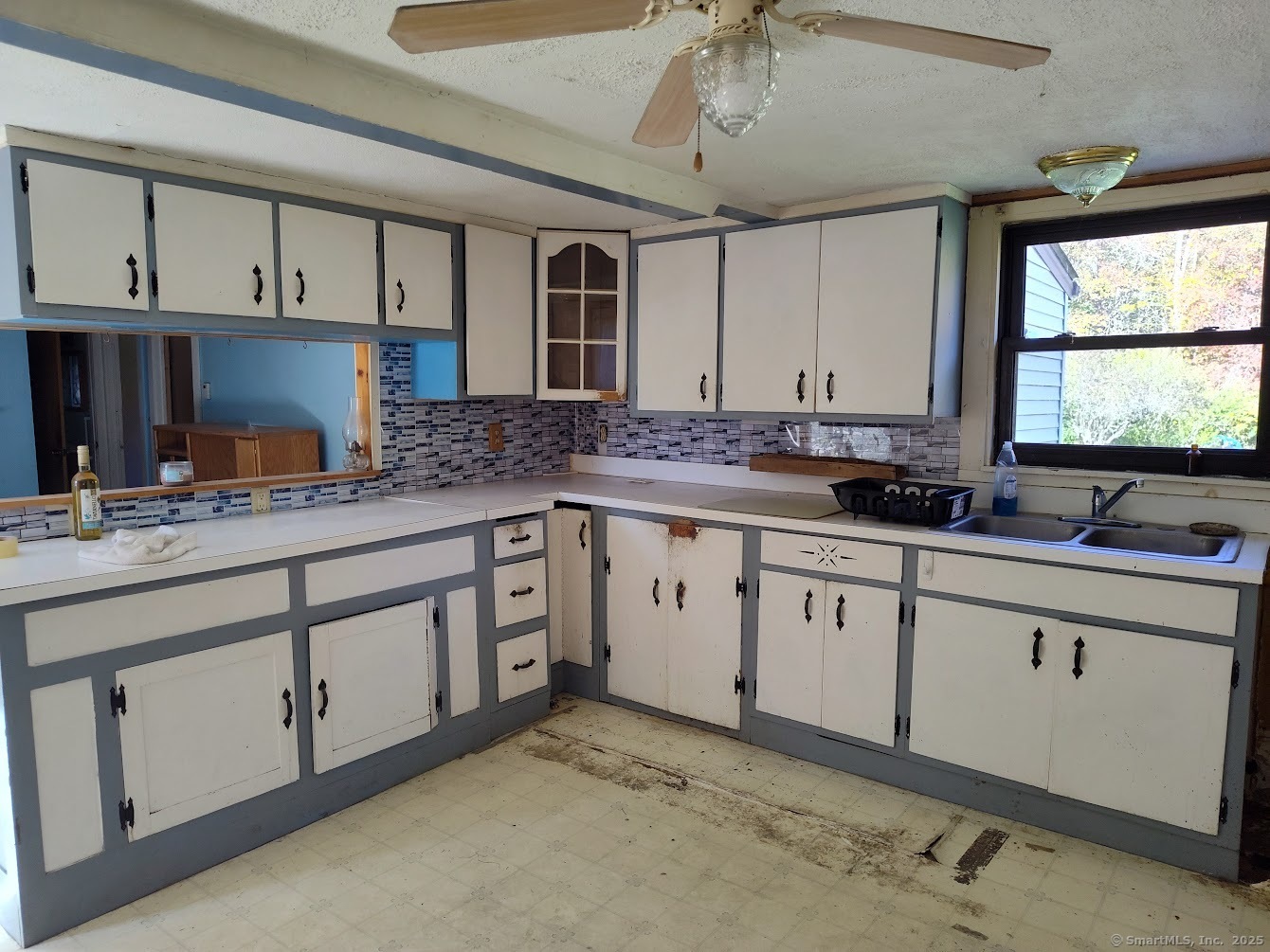 155 Iron Street Ledyard, CT 06339 - Photo 8 of 17 a kitchen with granite countertop a sink cabinets stainless steel appliances and a window