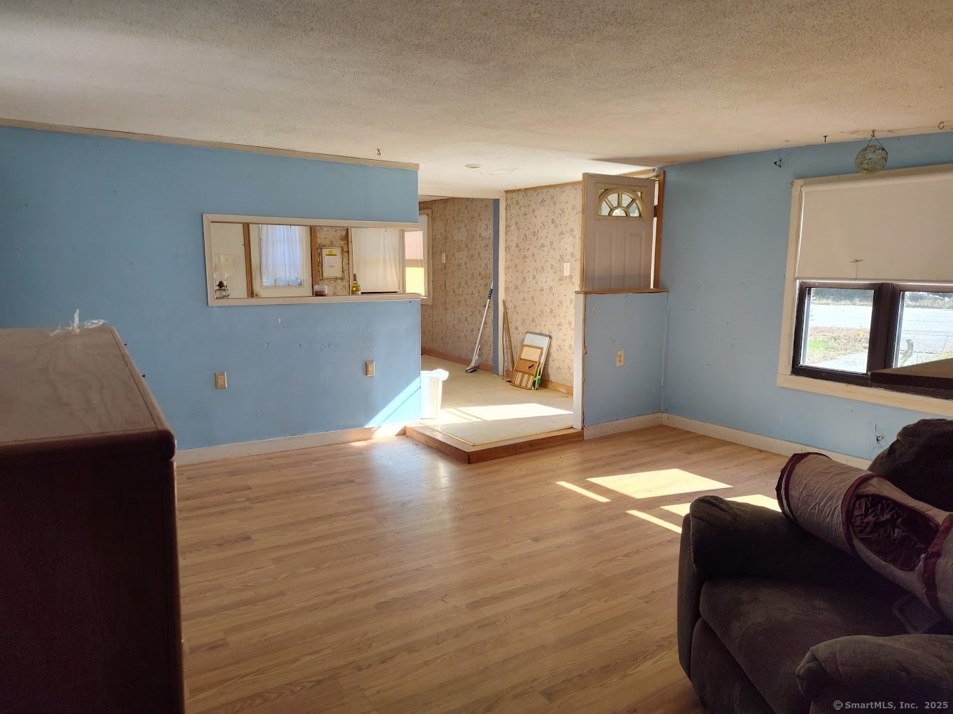 155 Iron Street Ledyard, CT 06339 - Photo 9 of 17 a bedroom with furniture and a wooden floor