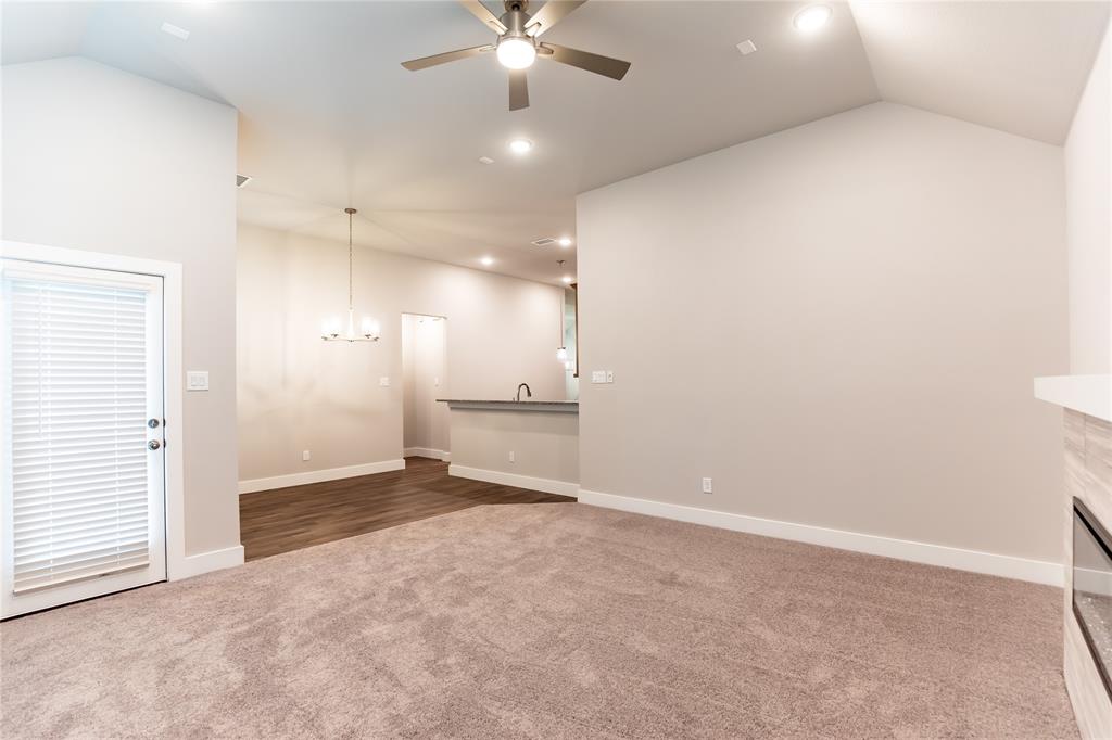 6124 Shasta Creek Road Celina, TX 75009 - Photo 3 of 27 wooden floor in an empty room with a ceiling fan