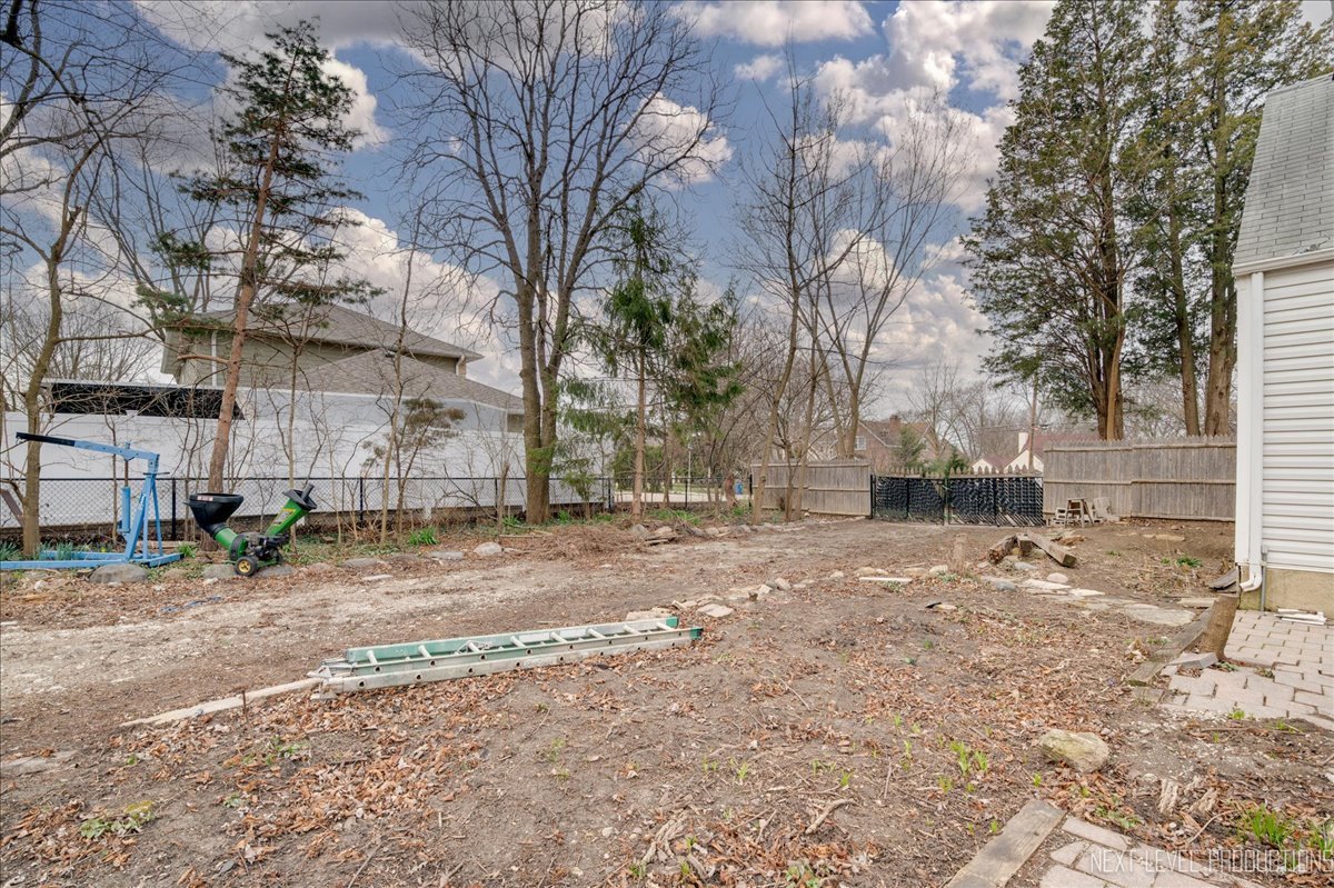 1703 Stoddard Avenue Wheaton, IL 60187 - Photo 9 of 9 a view of a yard with a tree