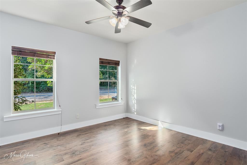 550 Linton Bellevue Road Benton, LA 71006 - Photo 20 of 37 Secondary bedroom with wood laminate floors and baseboards
