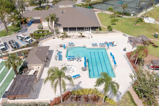 an aerial view of a house with garden space and lake view