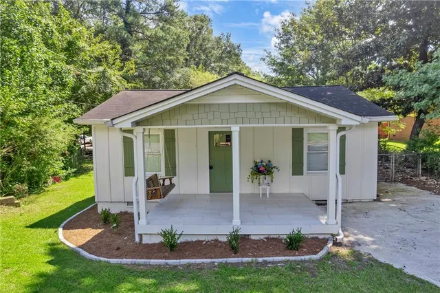 a front view of a house with garden