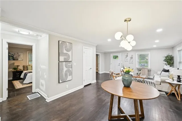 a view of a dining room with furniture and wooden floor