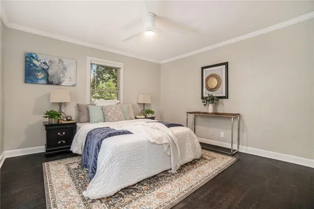 a bedroom with a bed and a table