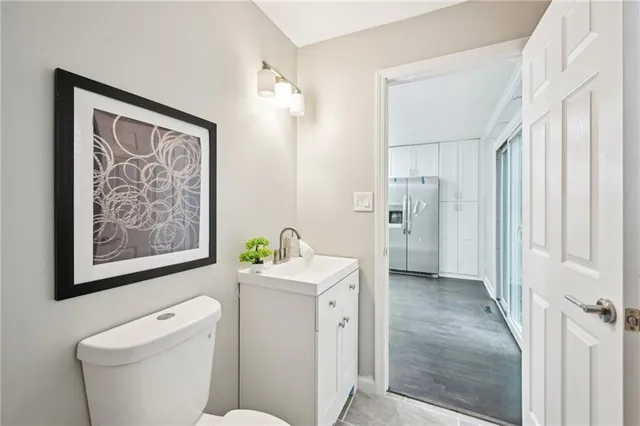 a bathroom with a toilet sink and shower