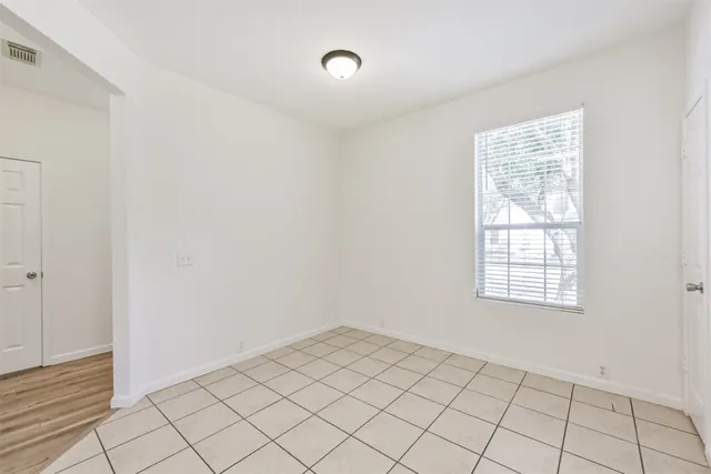 a view of an empty room and window