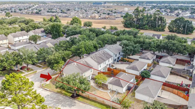 an aerial view of residential house with outdoor space and lake view