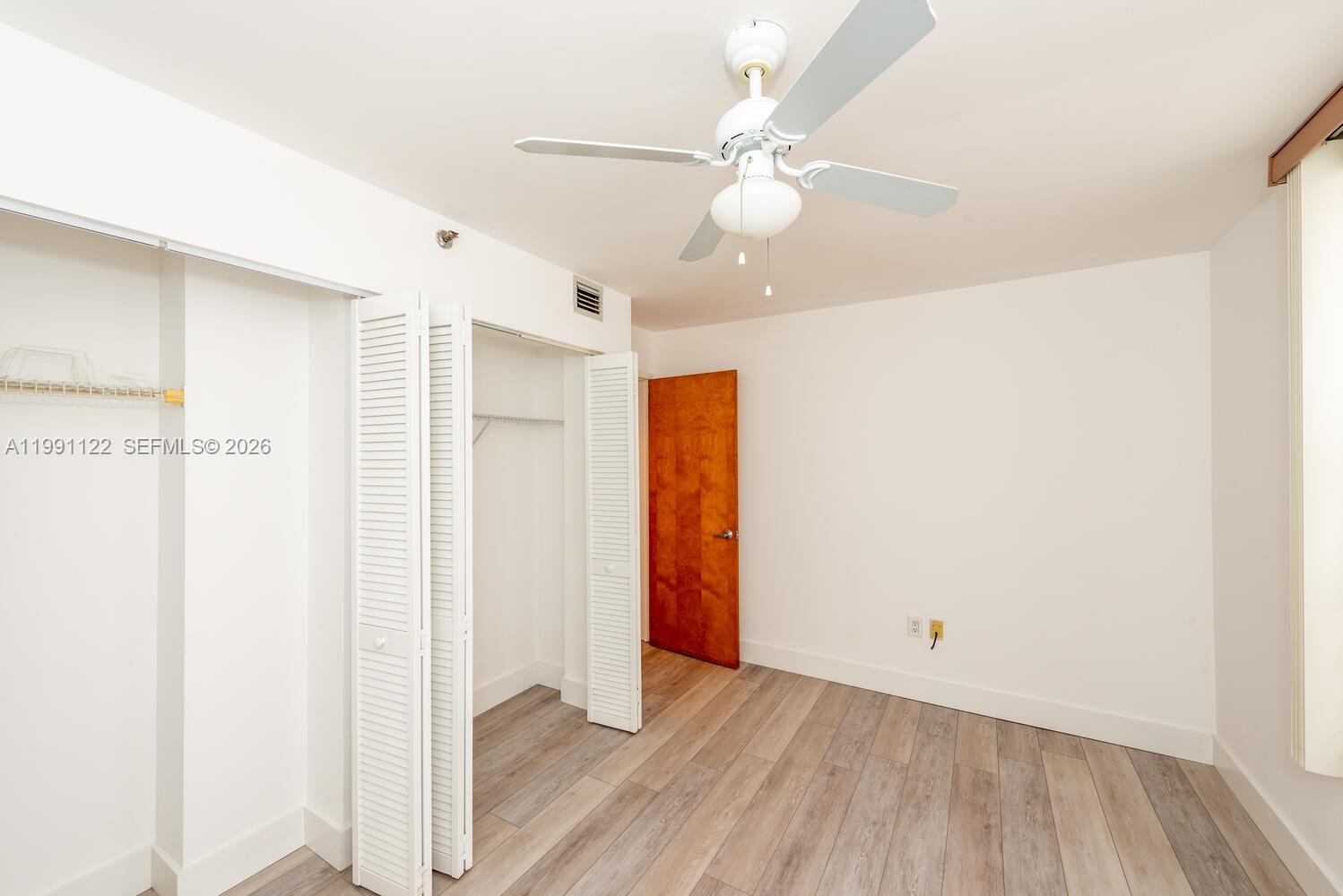 2801 Florida Avenue, Unit 441 Miami, FL 33133 - Photo 14 of 24 a view of an empty room with wooden floor