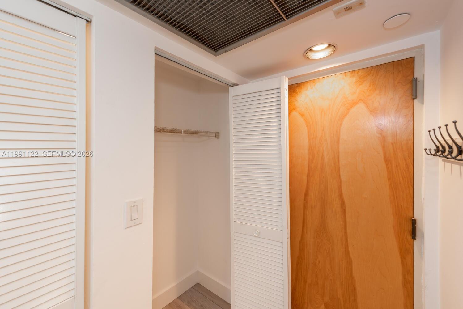 2801 Florida Avenue, Unit 441 Miami, FL 33133 - Photo 17 of 24 a bathroom with a shower and a window