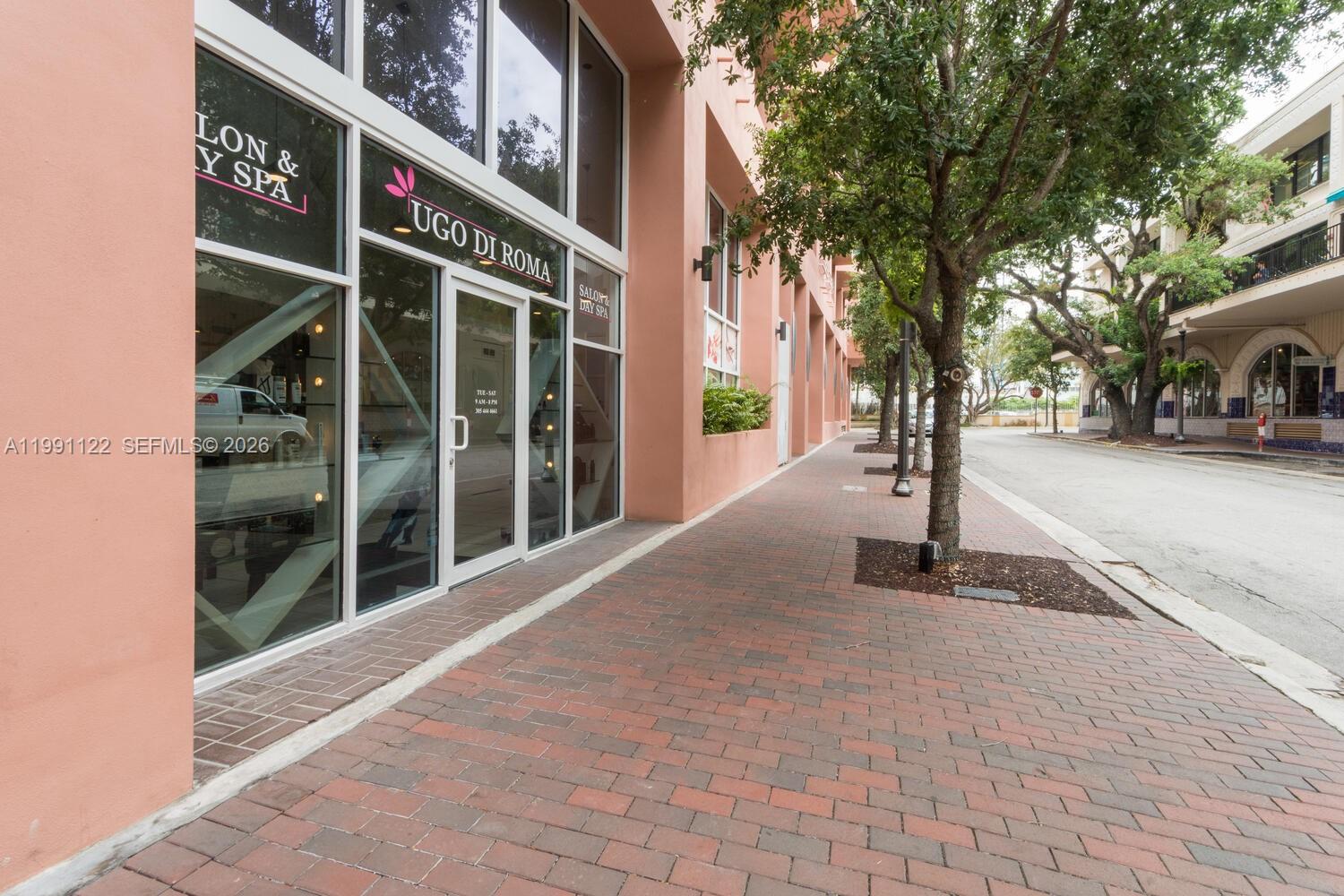 2801 Florida Avenue, Unit 441 Miami, FL 33133 - Photo 21 of 24 a front view of a building with trees