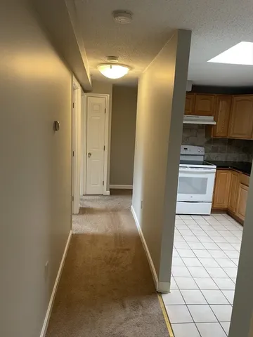a view of a kitchen from the hallway