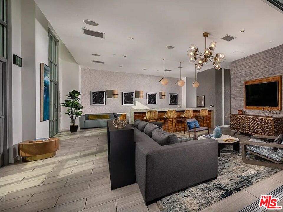 707 East Ocean Boulevard, Unit PH1615 Long Beach, CA 90802 - Photo 19 of 21 a living room with furniture and a flat screen tv