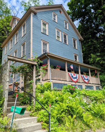 a view of house with yard