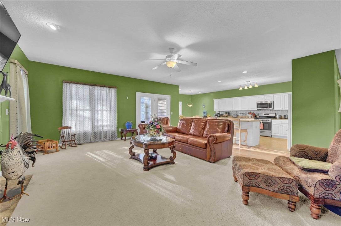 2690 Mayfair Road Akron, OH 44312 - Photo 15 of 31 Living area featuring ceiling fan and light colored carpet