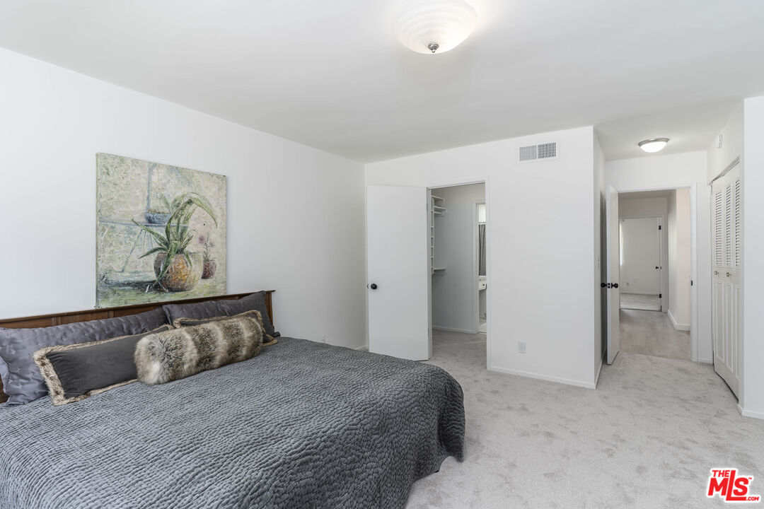 4139 Magna Carta Road Calabasas, CA 91302 - Photo 17 of 33 a bedroom with a bed and painting on the wall