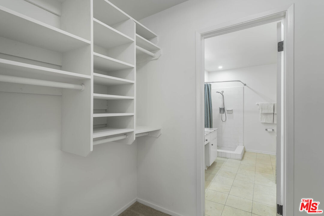 4139 Magna Carta Road Calabasas, CA 91302 - Photo 18 of 33 a bathroom with a shower and a toilet