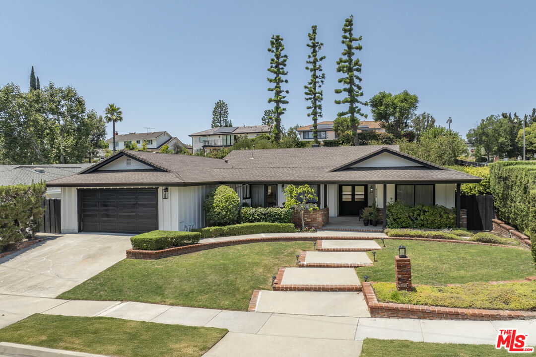 4139 Magna Carta Road Calabasas, CA 91302 - Photo 2 of 33 a front view of a house with a yard