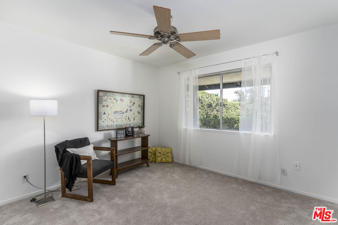 4139 Magna Carta Road Calabasas, CA 91302 - Photo 21 of 33 a living room with furniture and a window