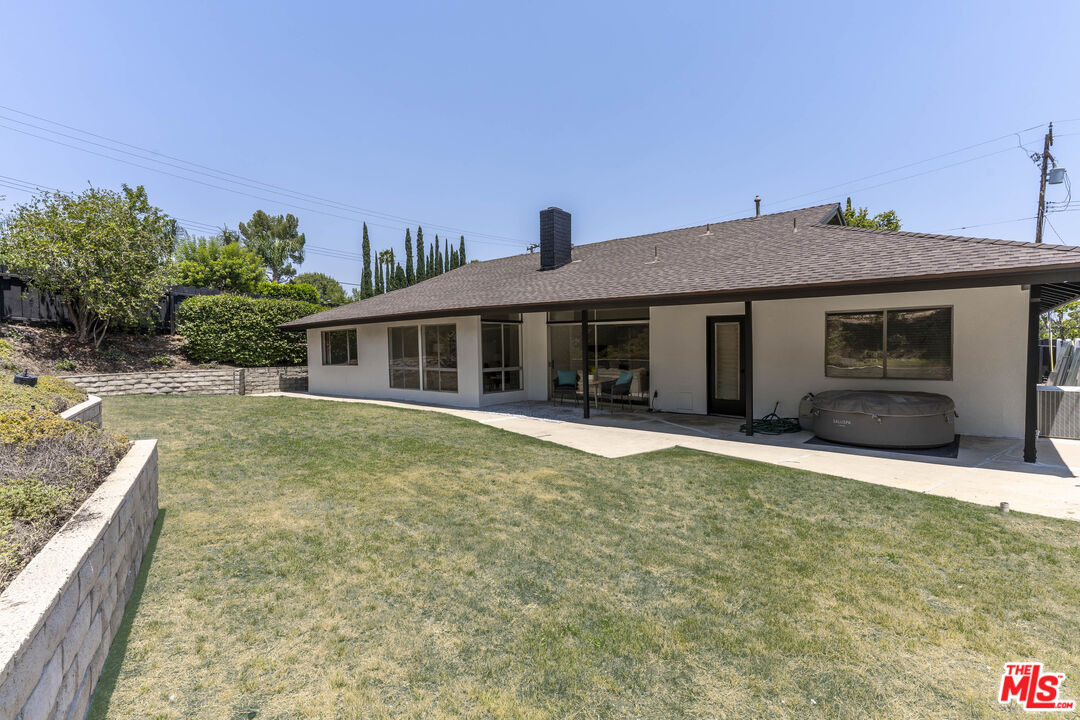 4139 Magna Carta Road Calabasas, CA 91302 - Photo 26 of 33 a front view of a house with a yard