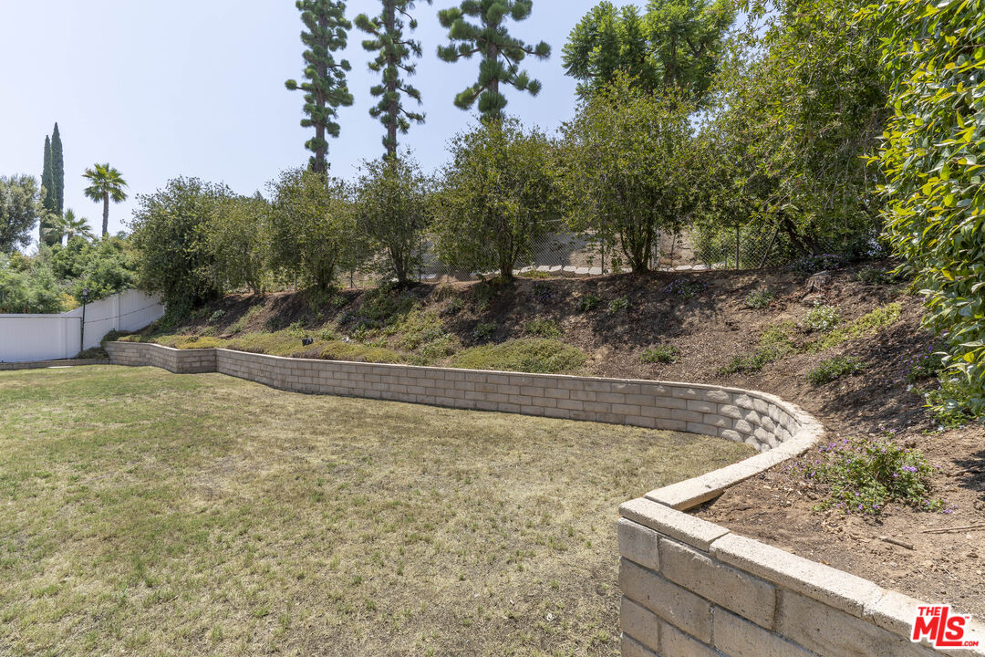 4139 Magna Carta Road Calabasas, CA 91302 - Photo 28 of 33 a view of a yard with large trees