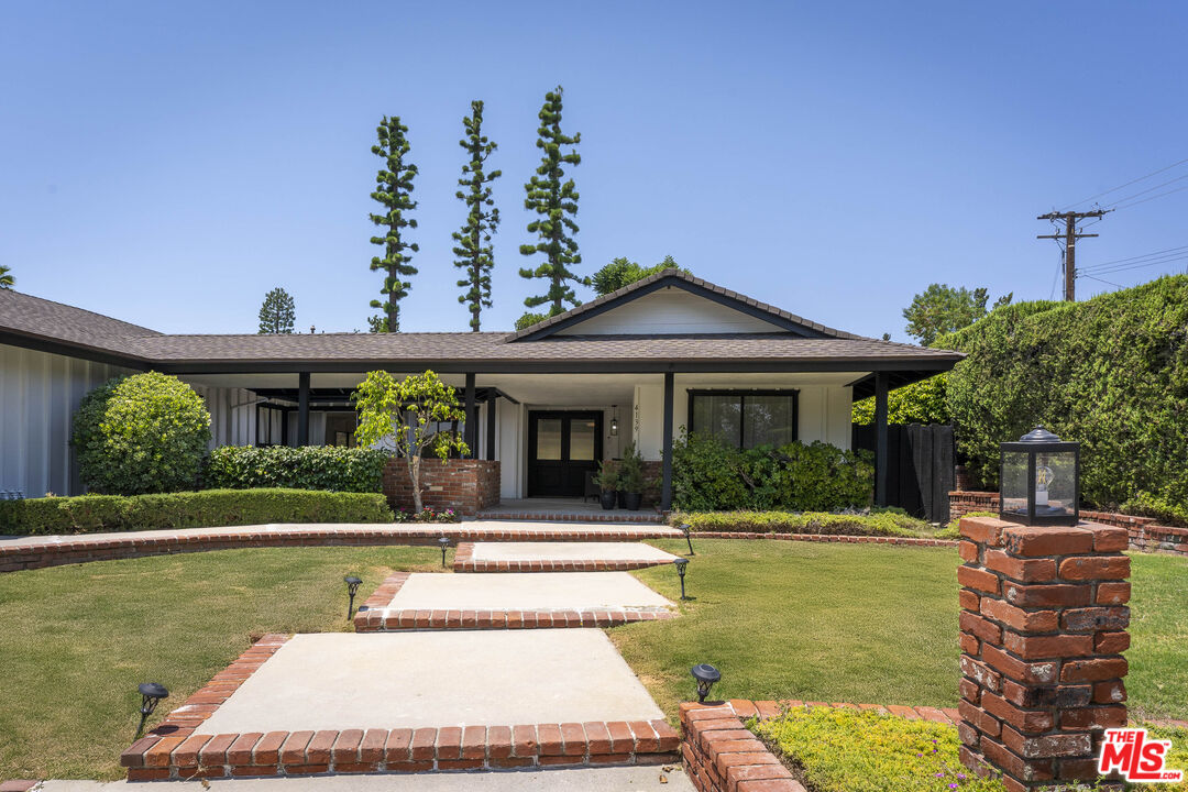 4139 Magna Carta Road Calabasas, CA 91302 - Photo 3 of 33 a front view of a house with garden
