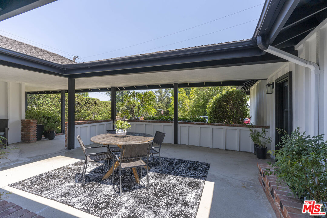 4139 Magna Carta Road Calabasas, CA 91302 - Photo 4 of 33 a dining room with furniture and a floor to ceiling window