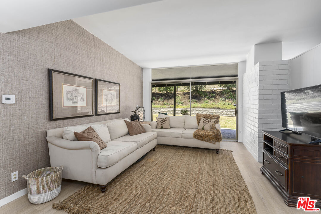 4139 Magna Carta Road Calabasas, CA 91302 - Photo 10 of 33 a living room with furniture and a large window
