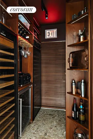 a living room with furniture a bookshelf and a fireplace