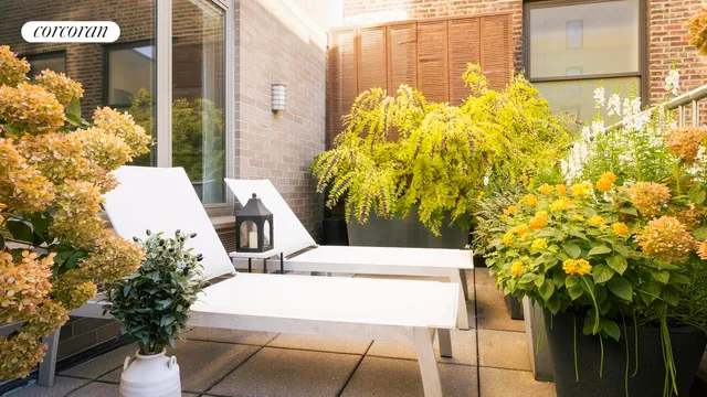 a kitchen with stainless steel appliances kitchen island granite countertop a sink and cabinets