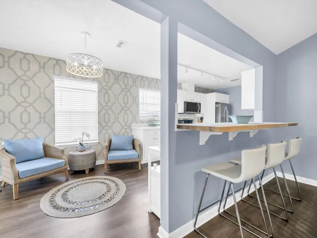 a bedroom with a bed and a chair