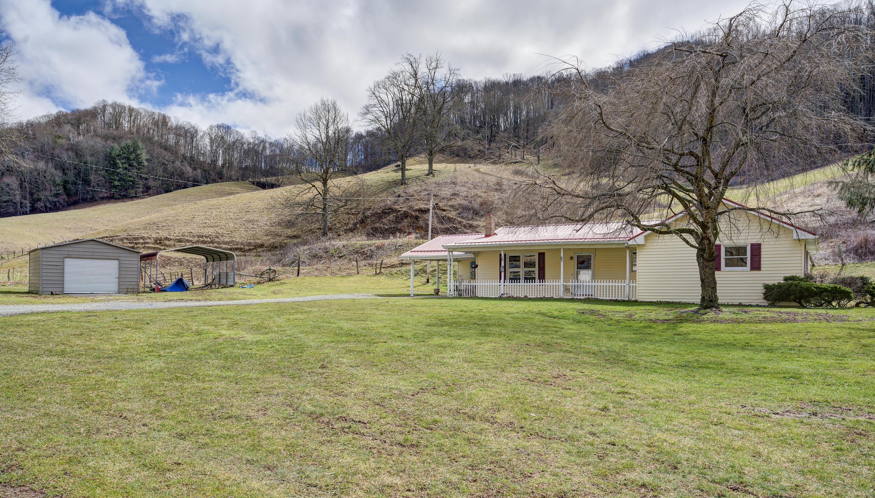 288 Shell Creek Road Roan Mountain, TN 37687 - Photo 2 of 31 Front of home and garage