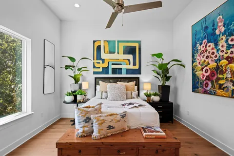 a bedroom with a bed and a table