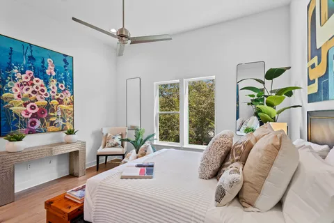 a bedroom with a bed furniture and a window