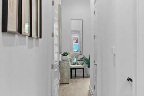 a view of a hallway with seating area